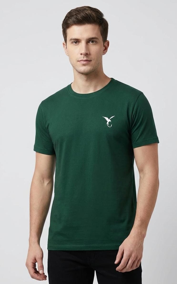 Man wearing dark green men’s t-shirt with minimal chest logo, short sleeves, regular fit on plain background
