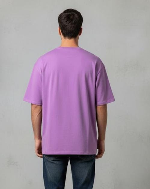 Back view of man wearing purple oversized men’s t-shirt, plain design with no print, casual fit on neutral background
